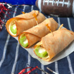 Buffalo Chicken RollUps with celery, provolone and blue cheese dressing.