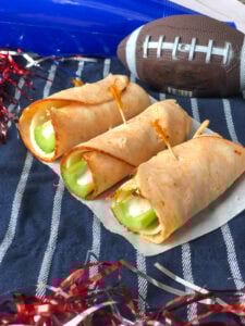 Buffalo Chicken RollUps with celery, provolone and blue cheese dressing.