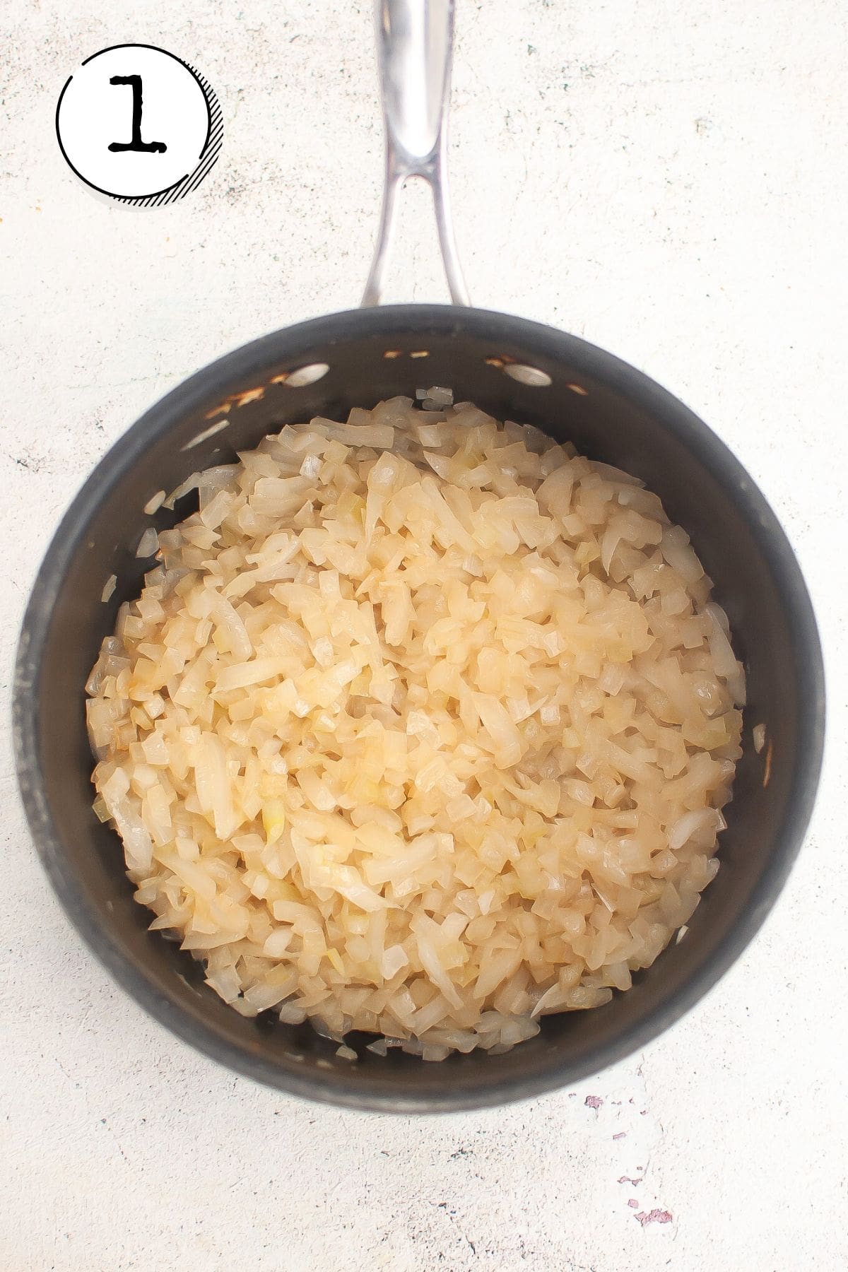 sauteeing onions with worcestshire sauce in pot.