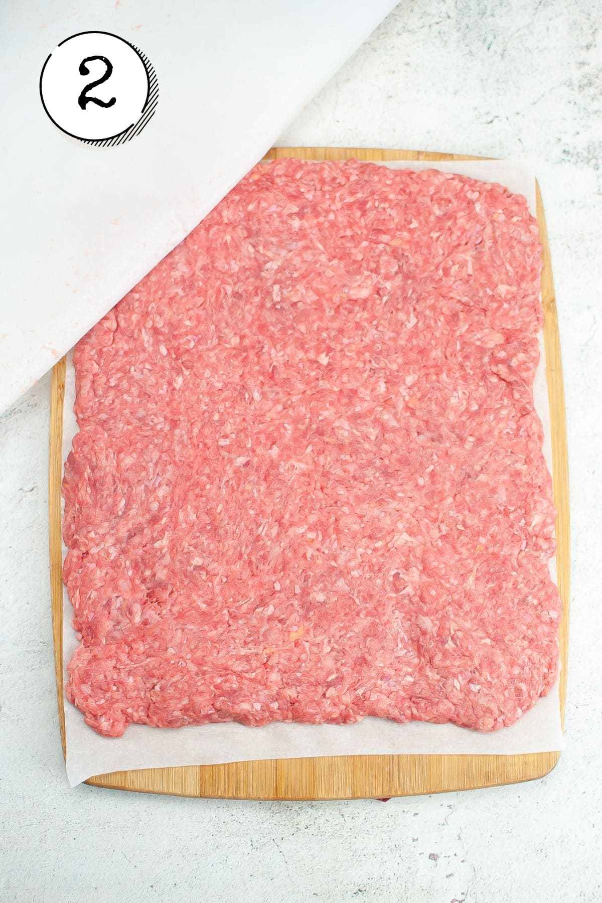 flattening beef with parchment paper