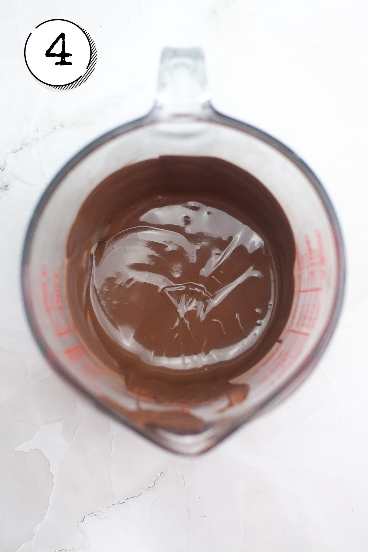 Melting the dark chocolate according to the package instructions In a microwave-safe bowl.