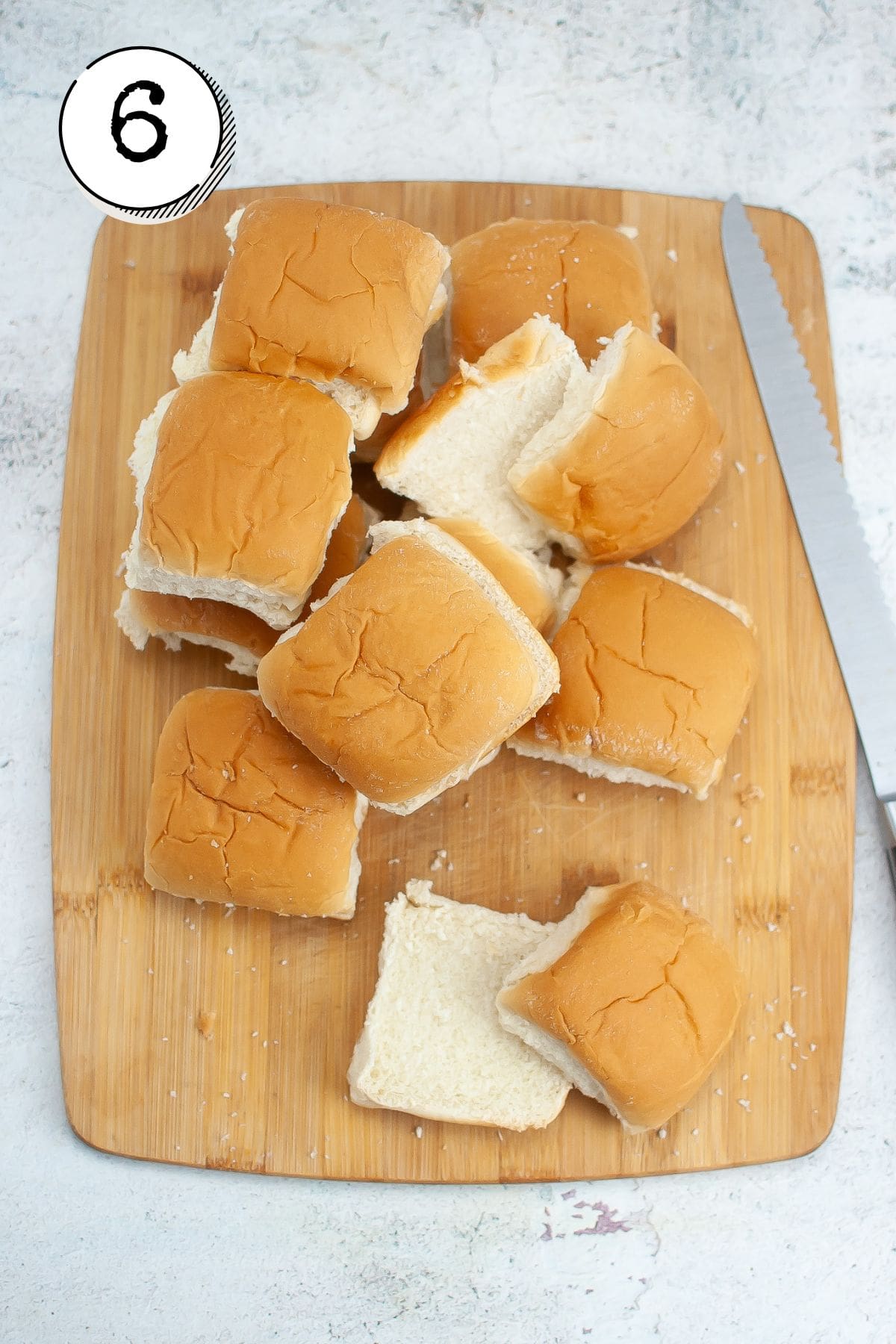 cutting the rolls in half to make buns