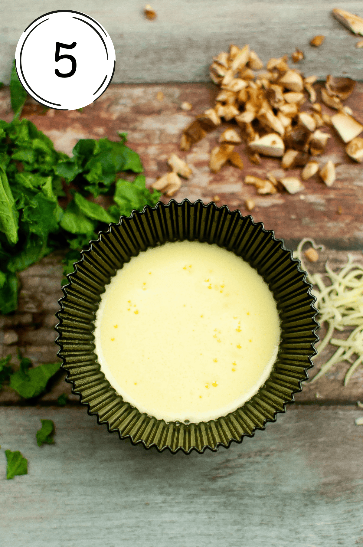 putting mixture into the silicone muffin liners sprayed with oil