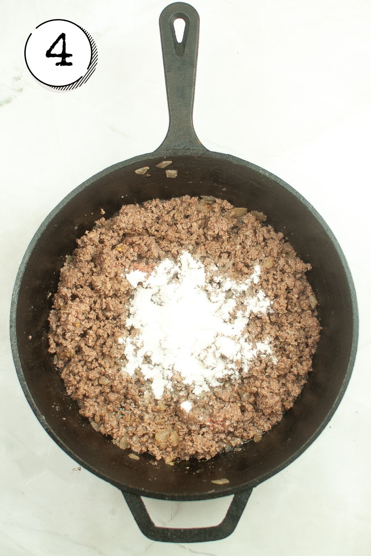 Adding salt, pepper, and flour to coat the meat.