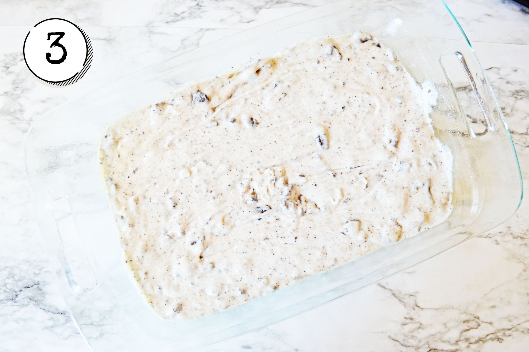 pouring the batter into the prepared baking dish.