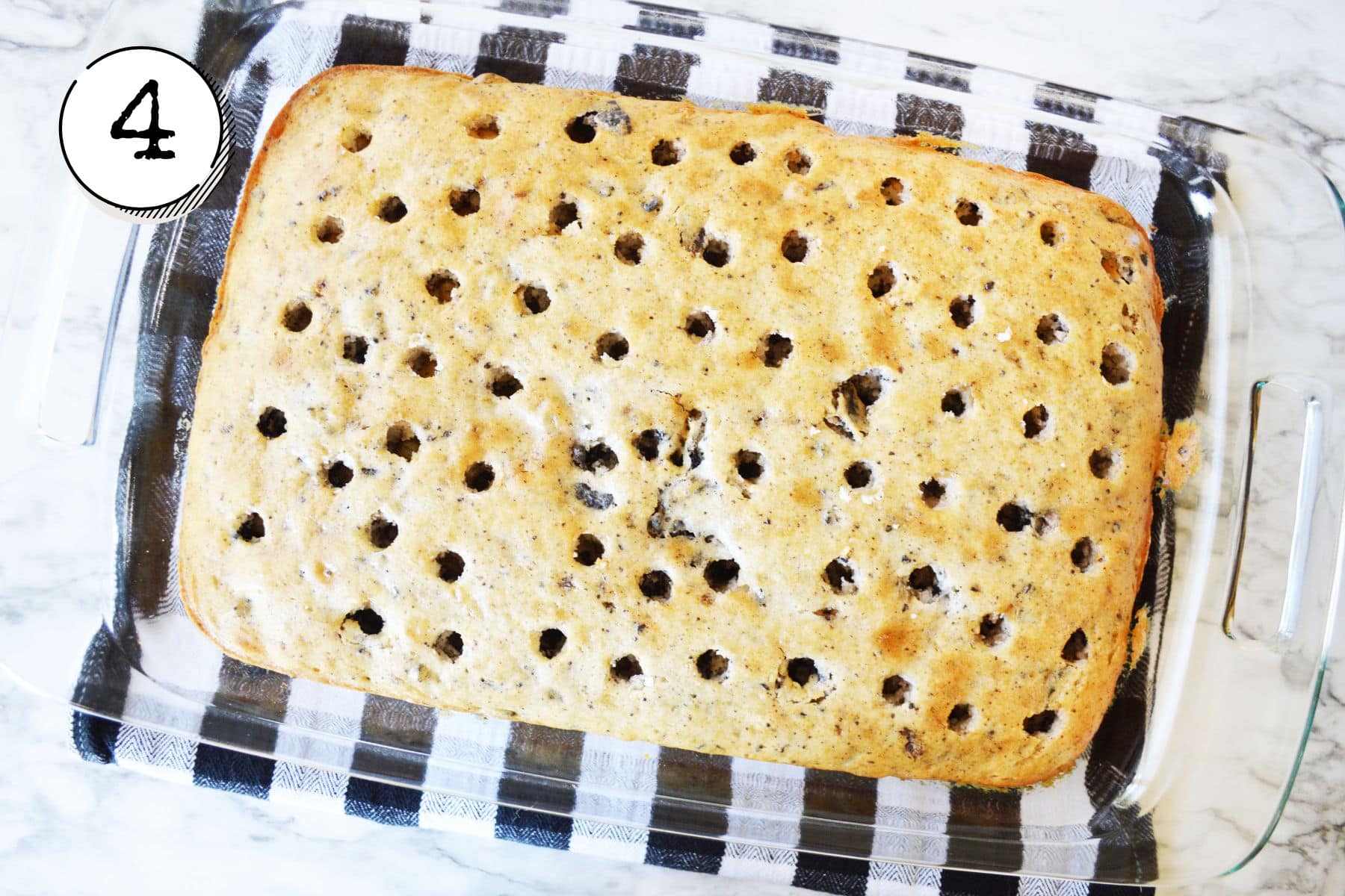 poking holes evenly across the top.