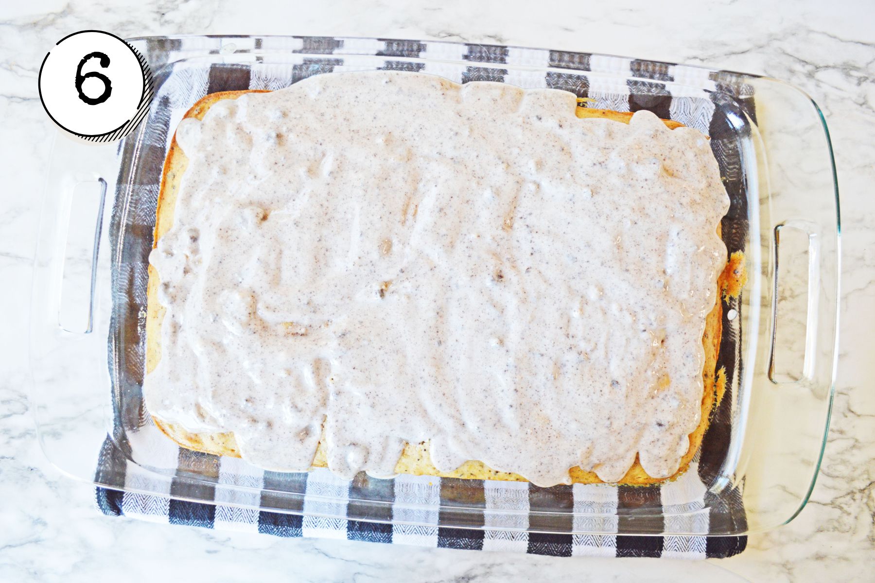 pouring the pudding mixture over the cake.