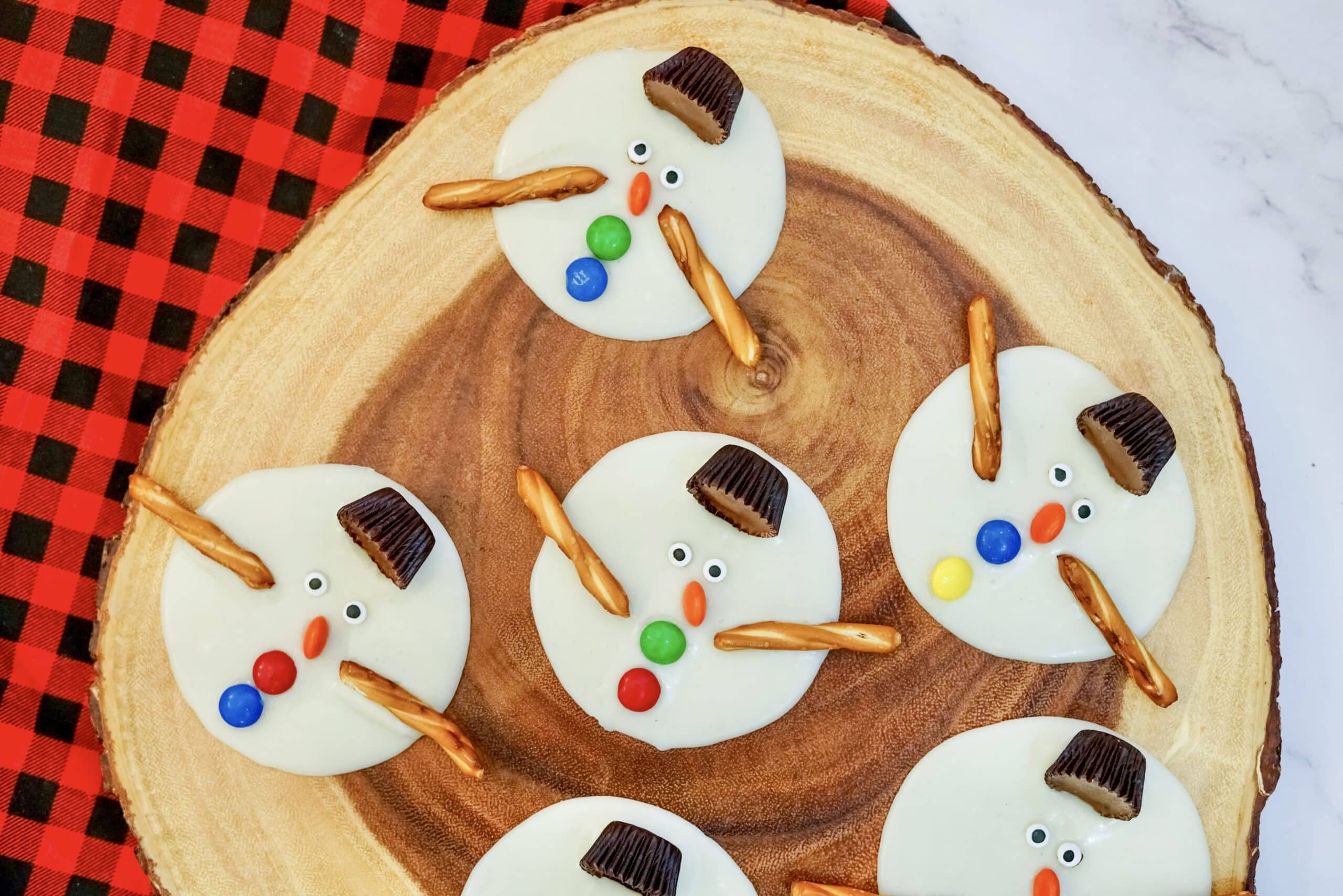 snowmen on a wood chop
