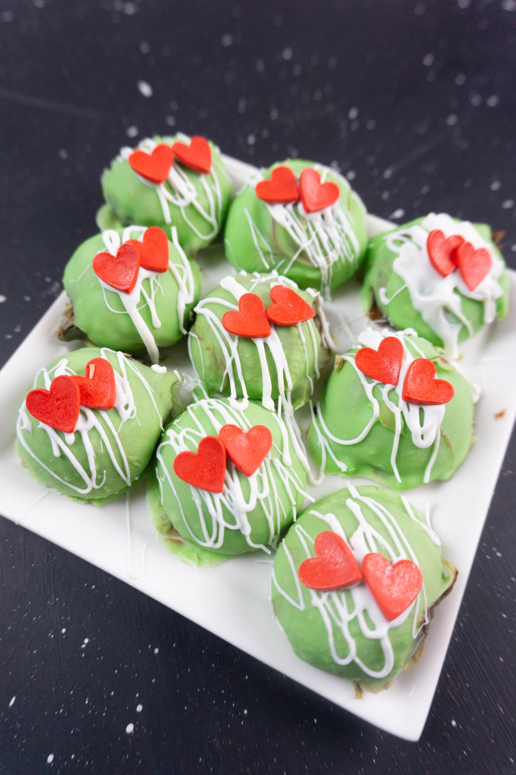 finished product on white plate with red heart toppings
