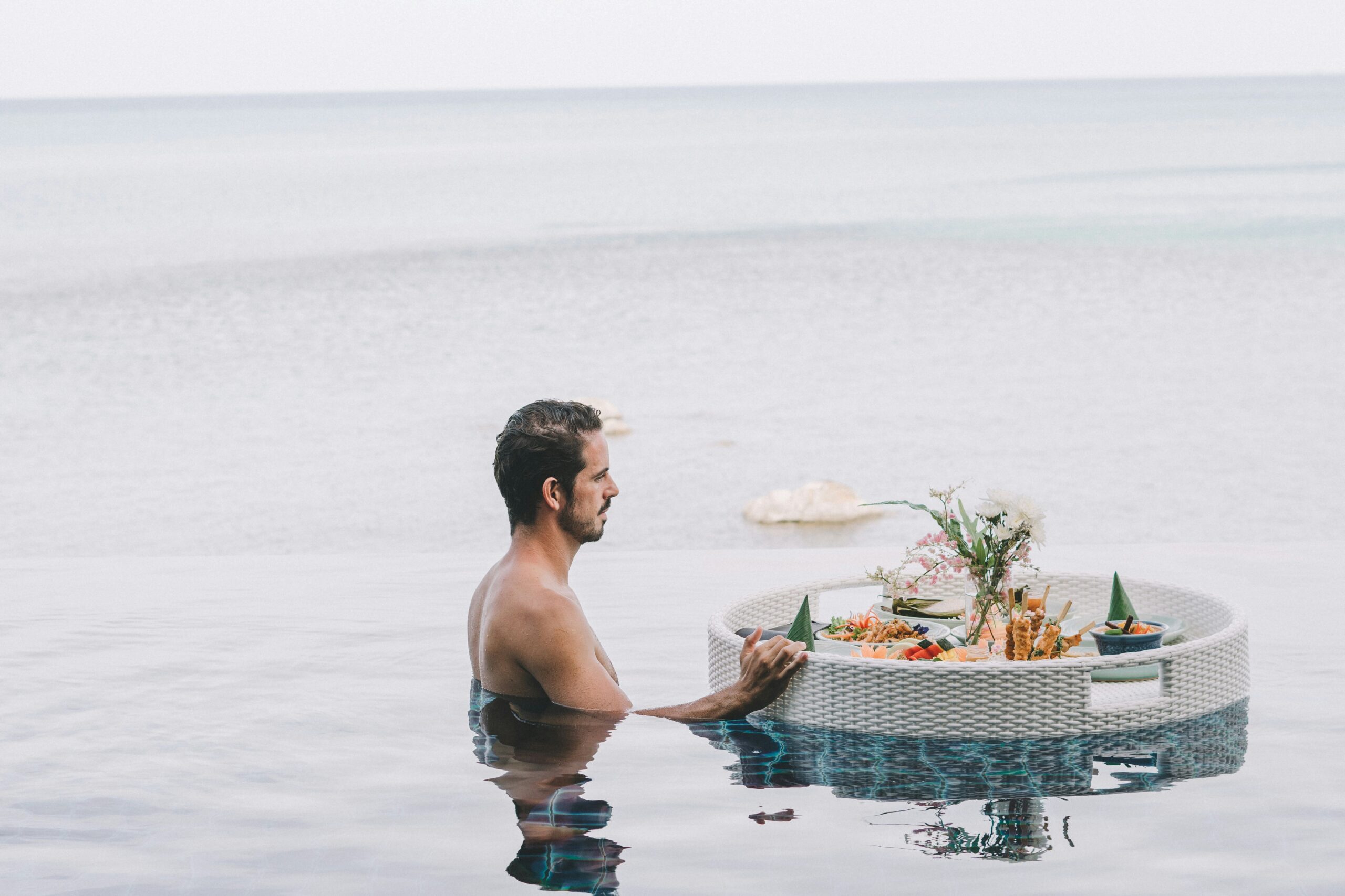 floating pool meal with guy