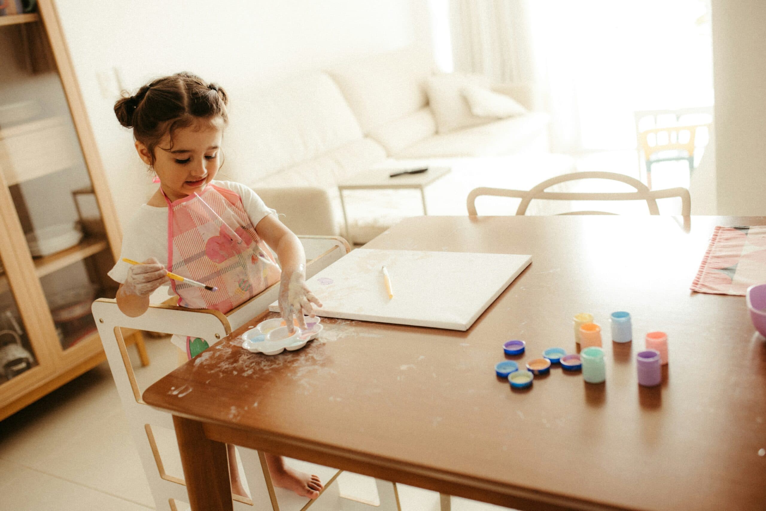 little girl with paint
