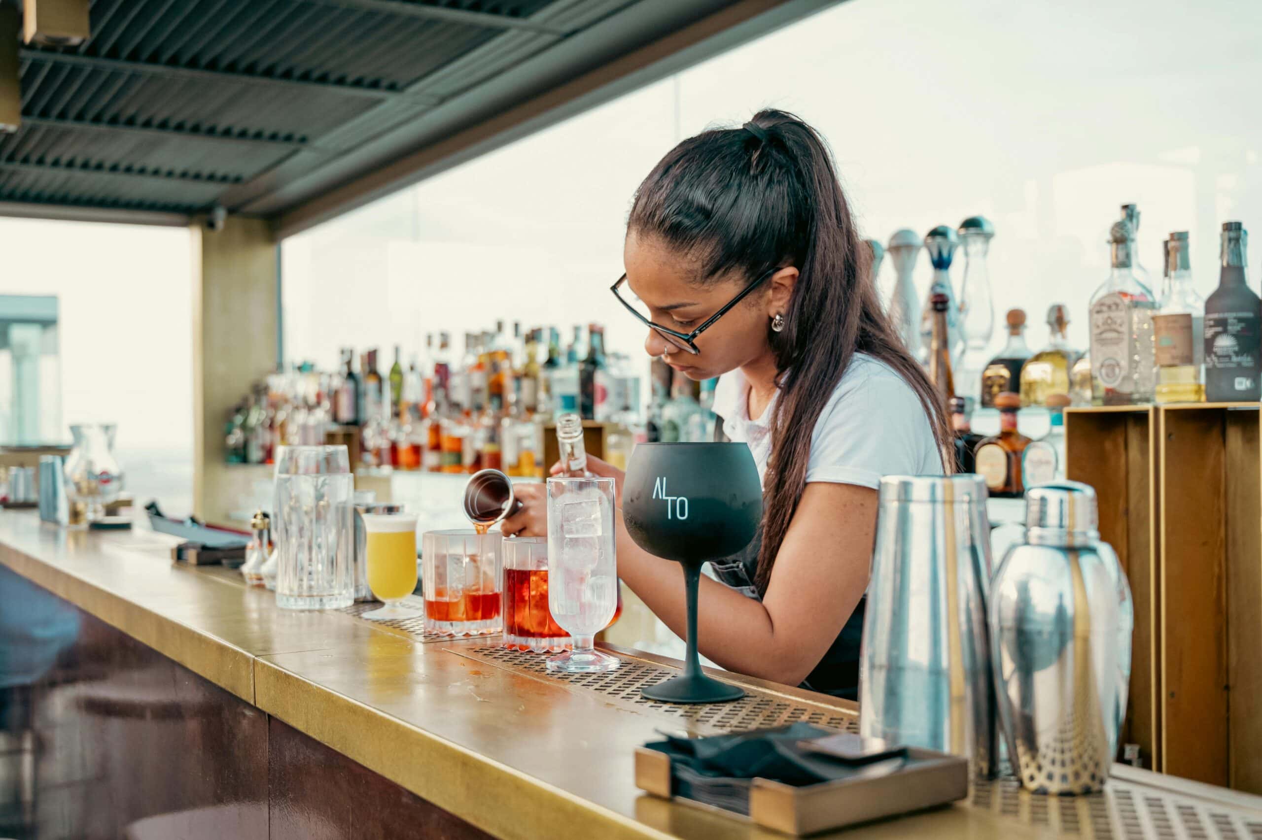 rooftop bartender mixing drinks