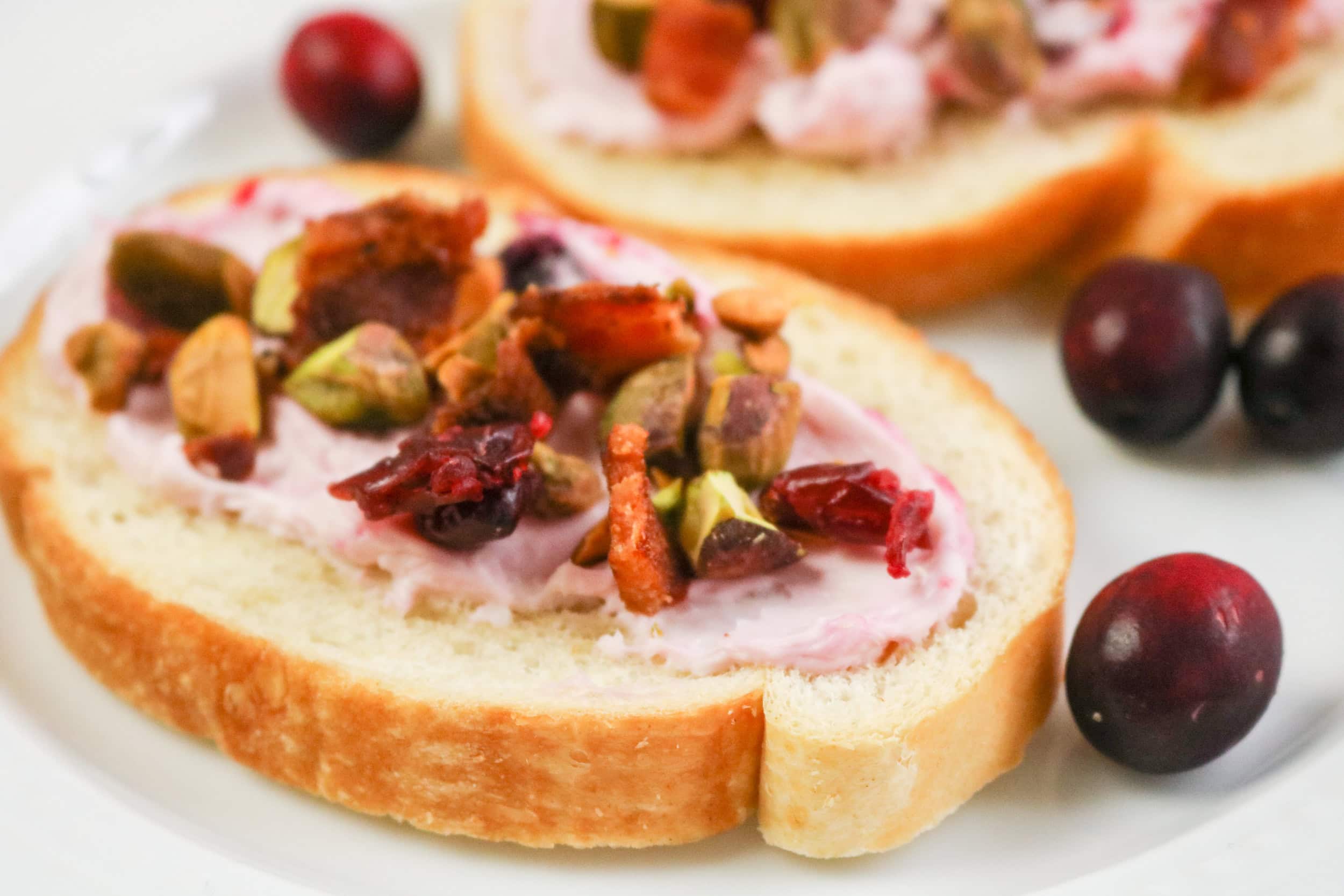 Bacon Pistachio and Cranberry Cream Cheese Crostini slice