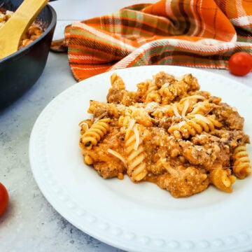 pasta on plate with red cothing