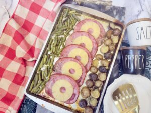 Sheet Pan Ham Dinner on red table cloth