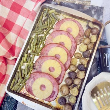 Sheet Pan Ham Dinner on red table cloth